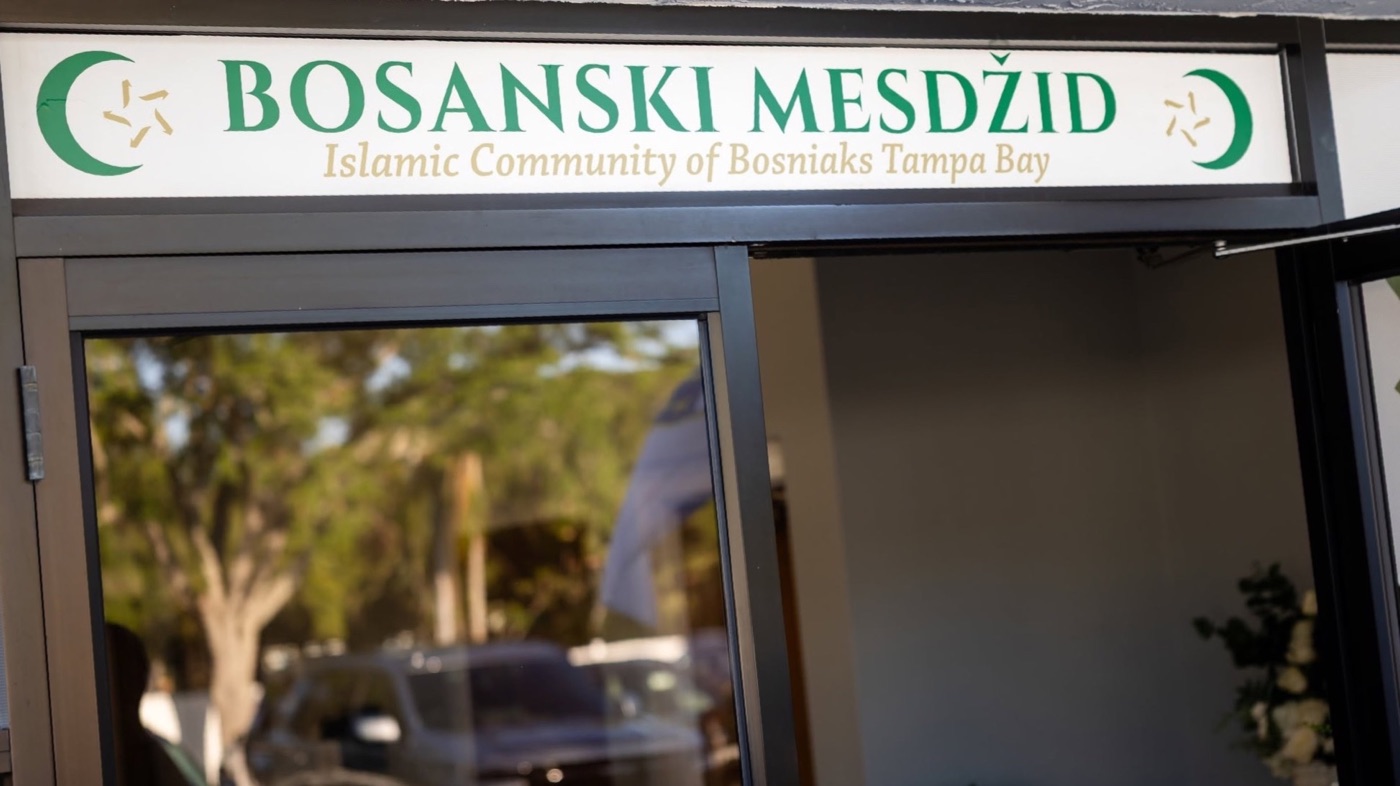 The entrance of the mosque with the Bosanski Mesdžid sign above the door